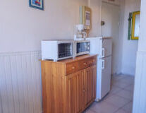 a kitchen with a wooden door